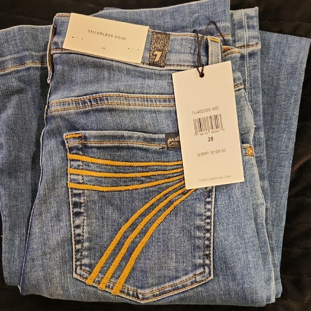 7 For All Mankind Women's Blue Jeans with Gold Stitching.